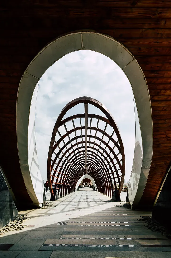 A view down a long architectural bridge.